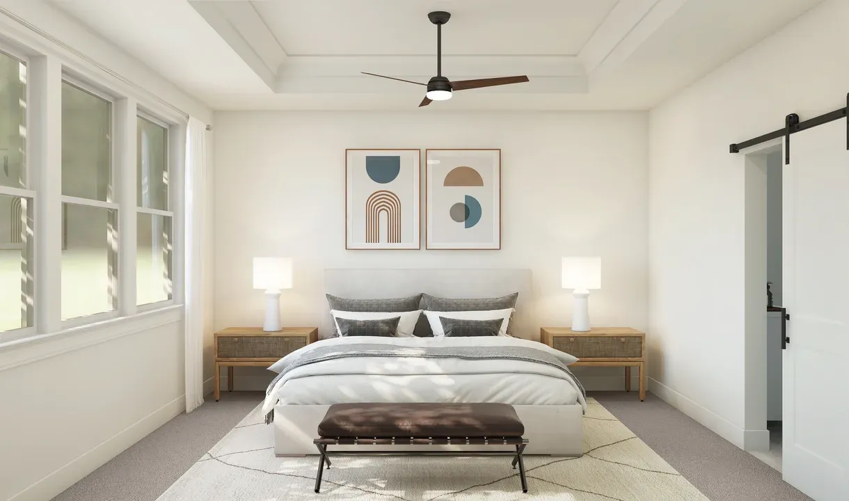Primary suite with ceiling fan and crown moulding
