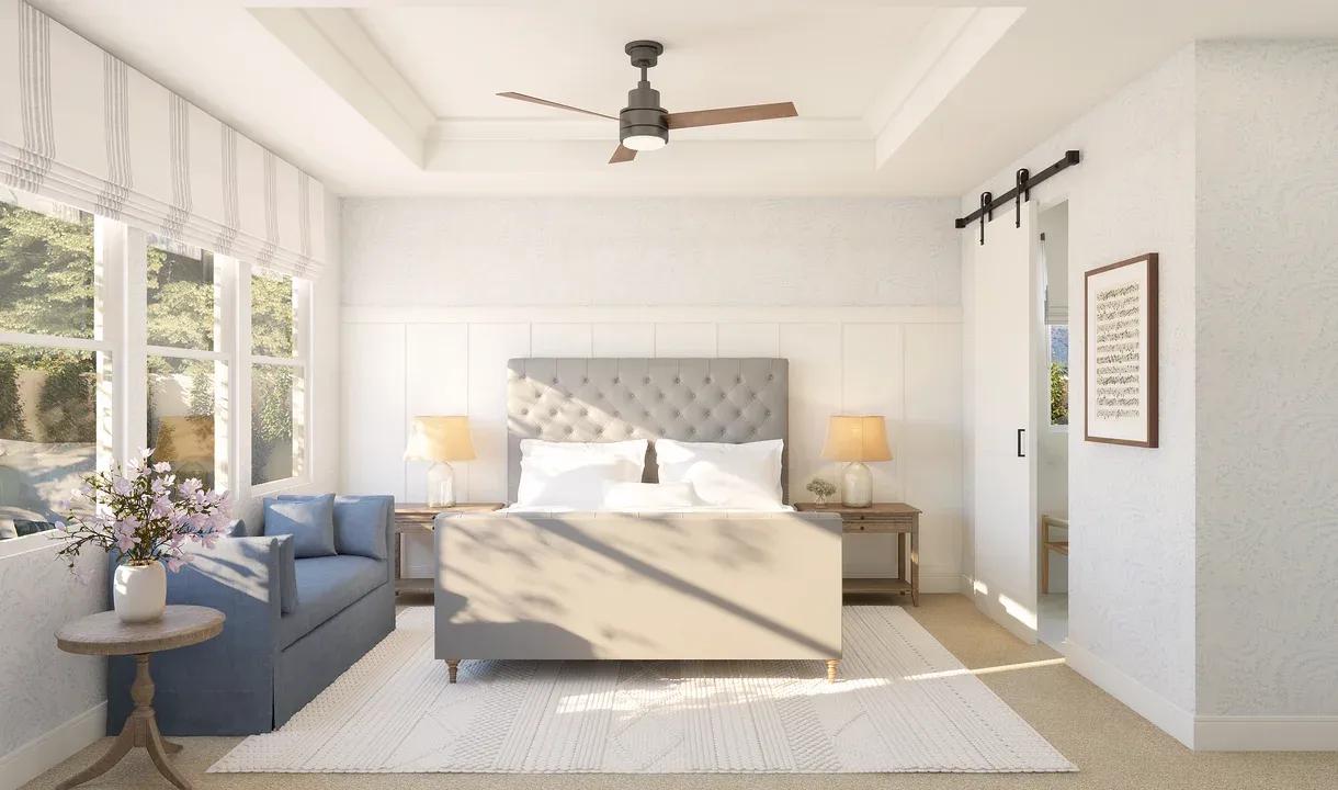 Primary suite with decorative feature wall and barn door to private bath