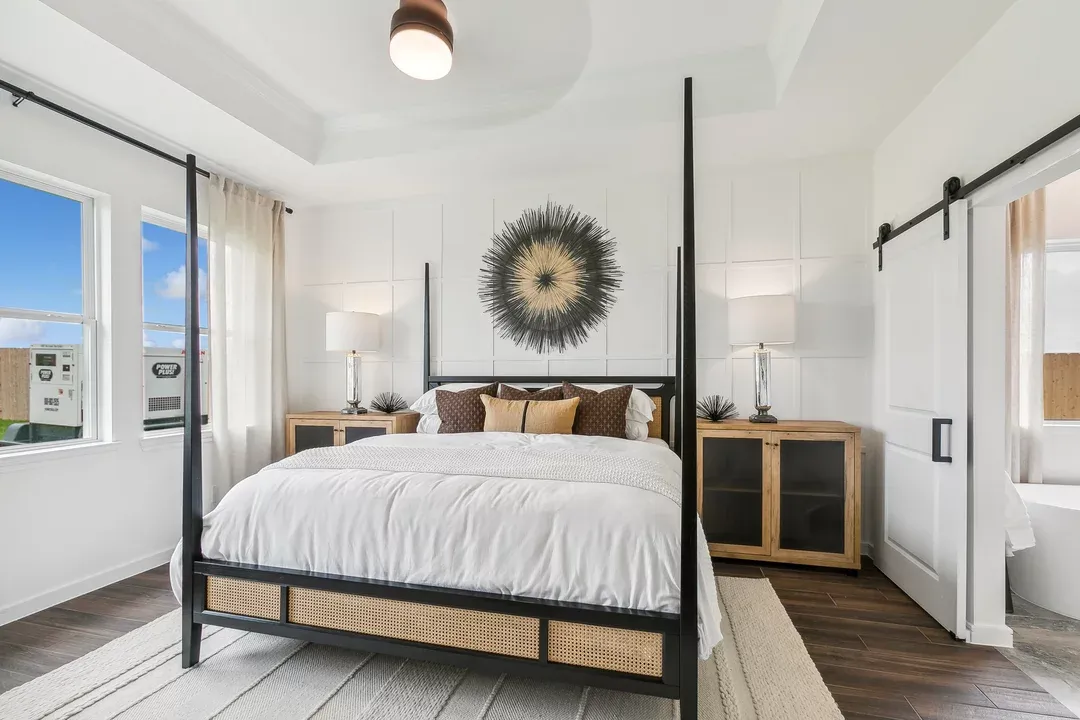 Primary suite with decorative feature wall