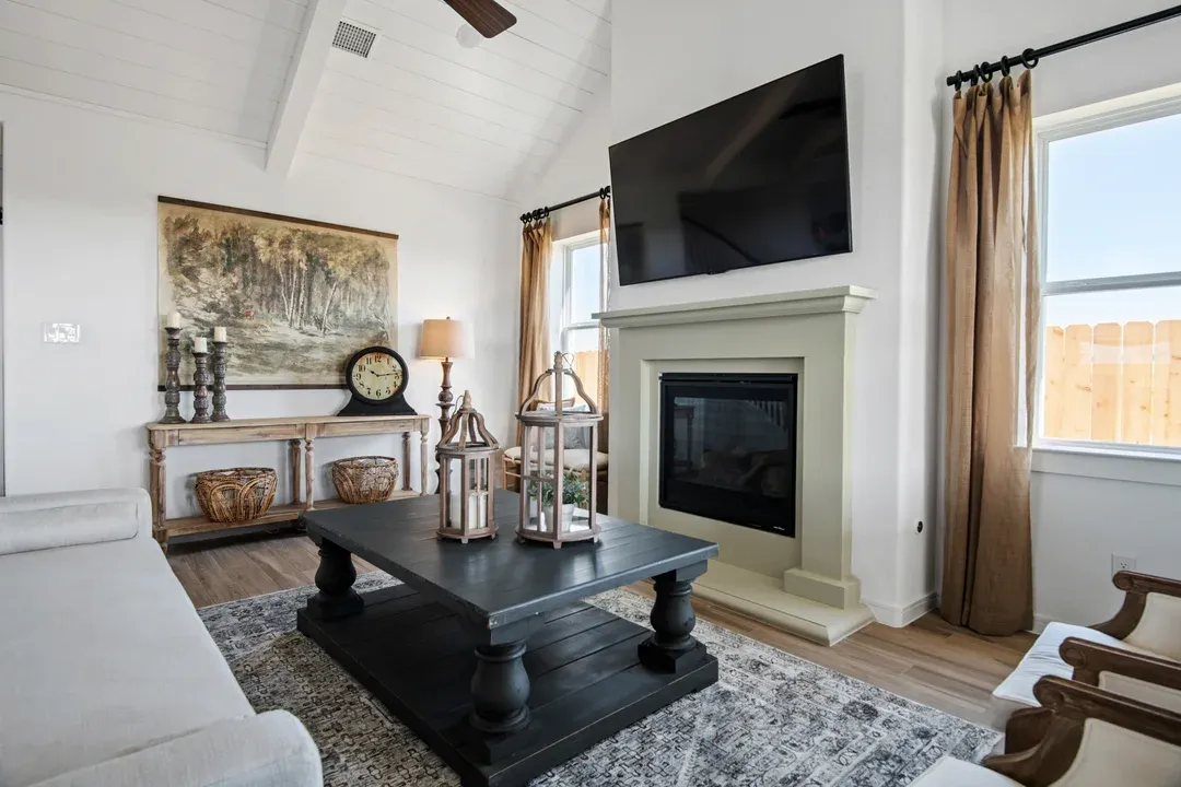Great room with white painted ceiling beams