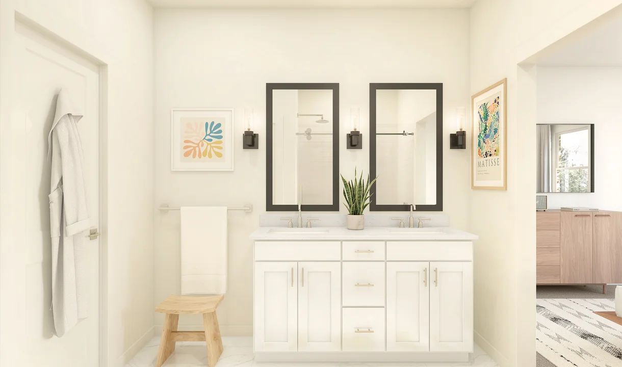 Primary bath with black-framed mirrors