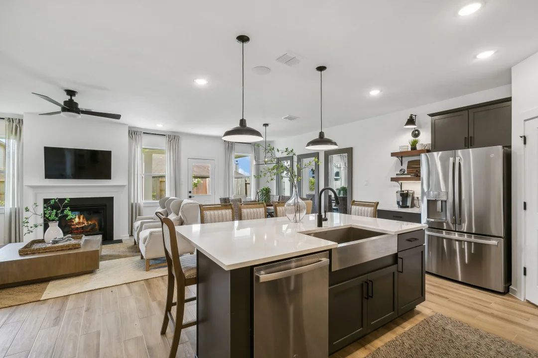 Kitchen with stainless steel apron-front sink