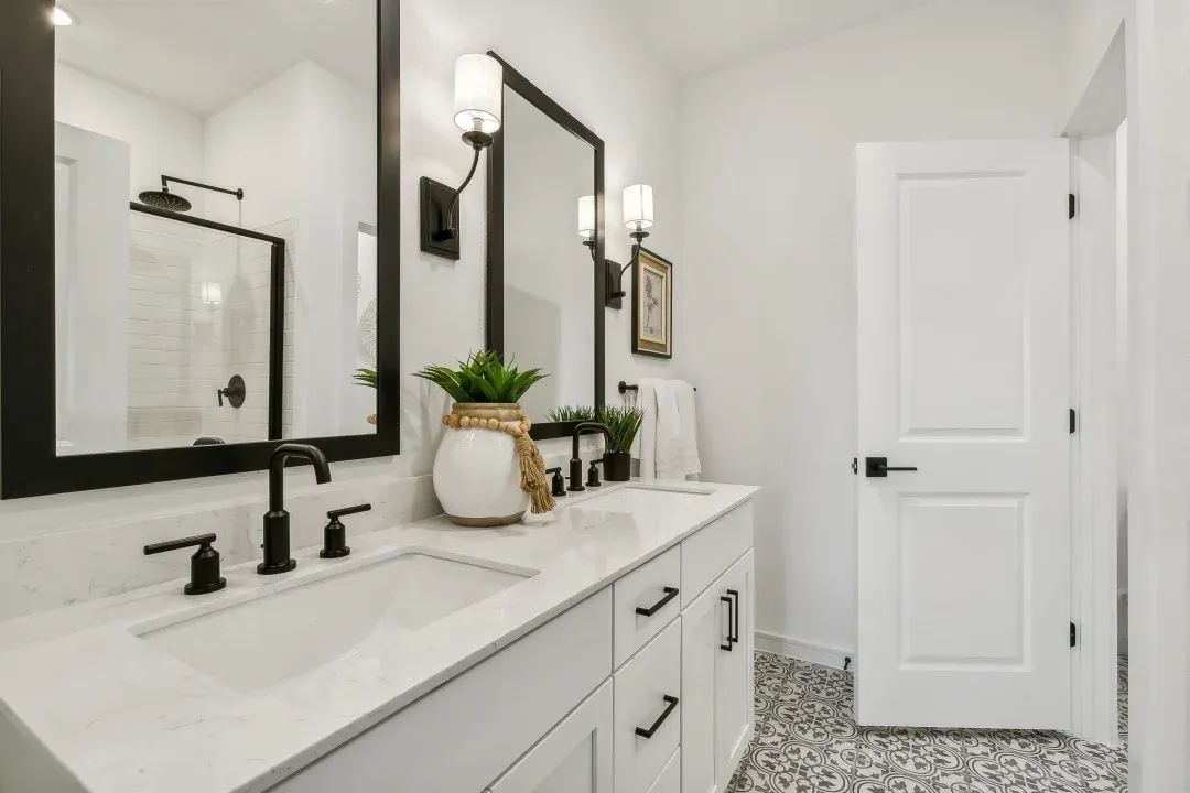 Primary bath features vanity with dual sinks