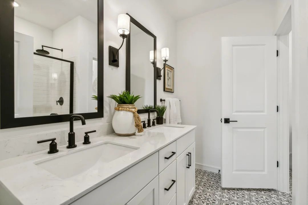 Primary bath features vanity with dual sinks
