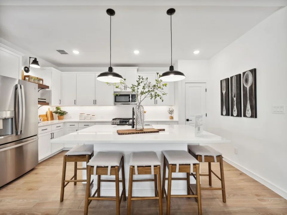 Kitchen with pendant lighting and floating shelves