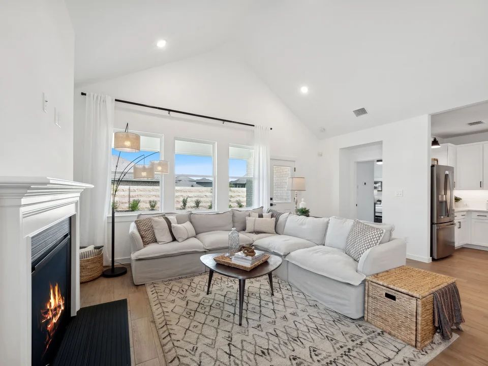 Great room with vaulted ceiling and fireplace