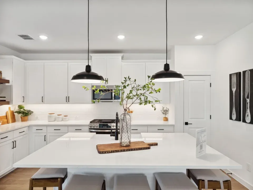 Kitchen with pendant lighting and floating shelves