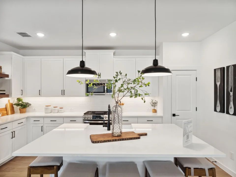 Kitchen with pendant lighting and floating shelves