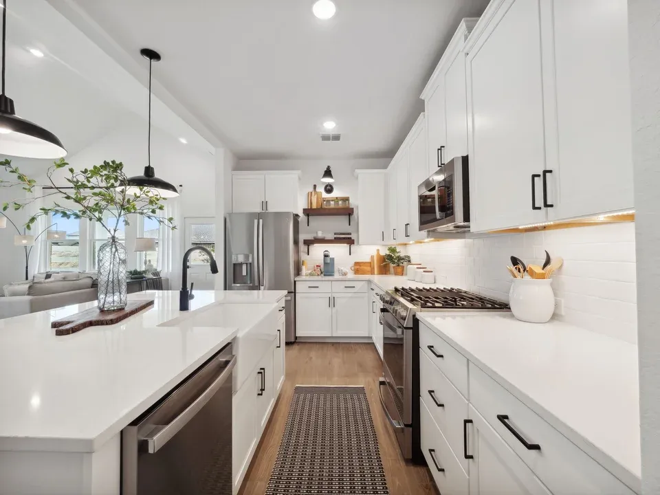 Kitchen with pendant lighting and floating shelves
