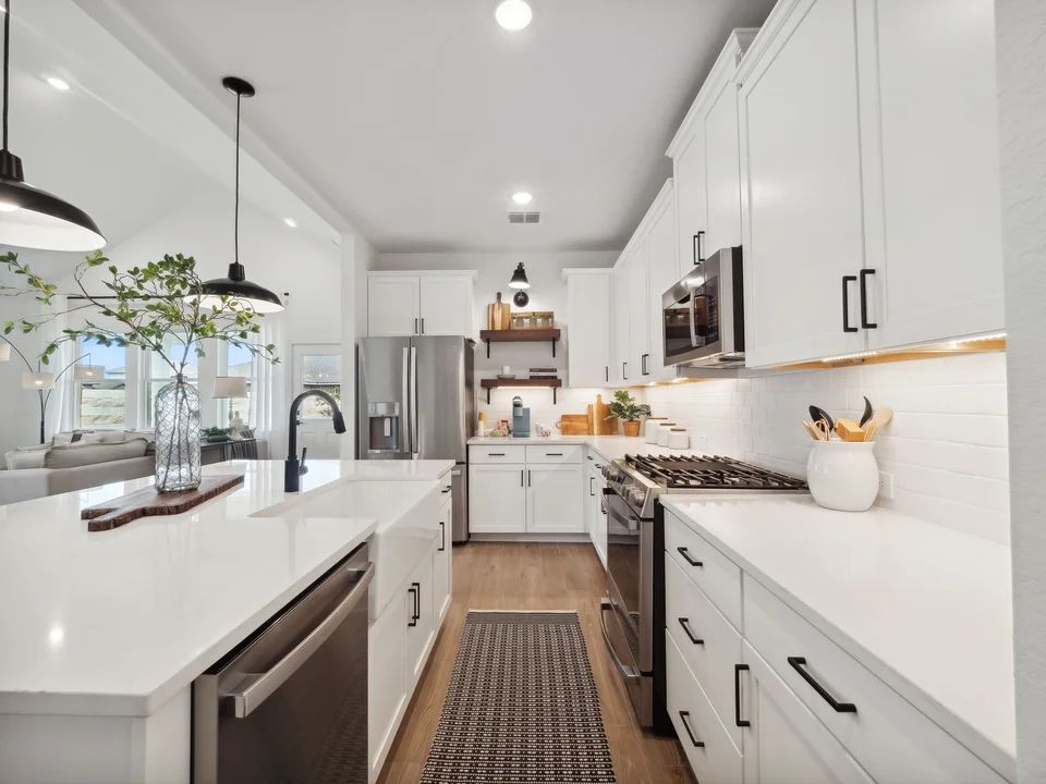 Kitchen with pendant lighting and floating shelves
