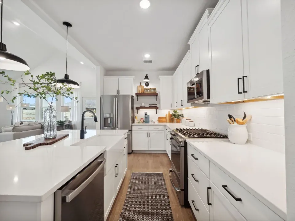 Kitchen with pendant lighting and floating shelves