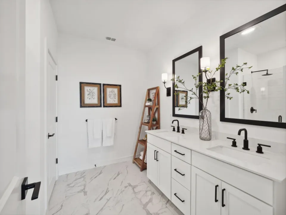 Primary bath features vanity with dual sinks