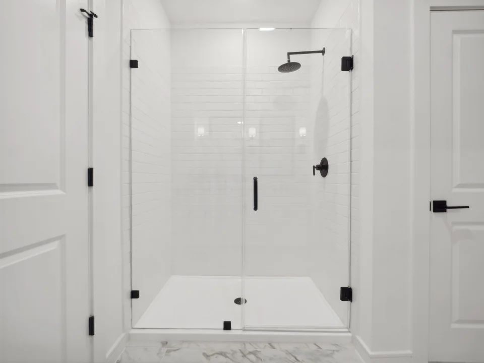 Primary bath with glass shower enclosure