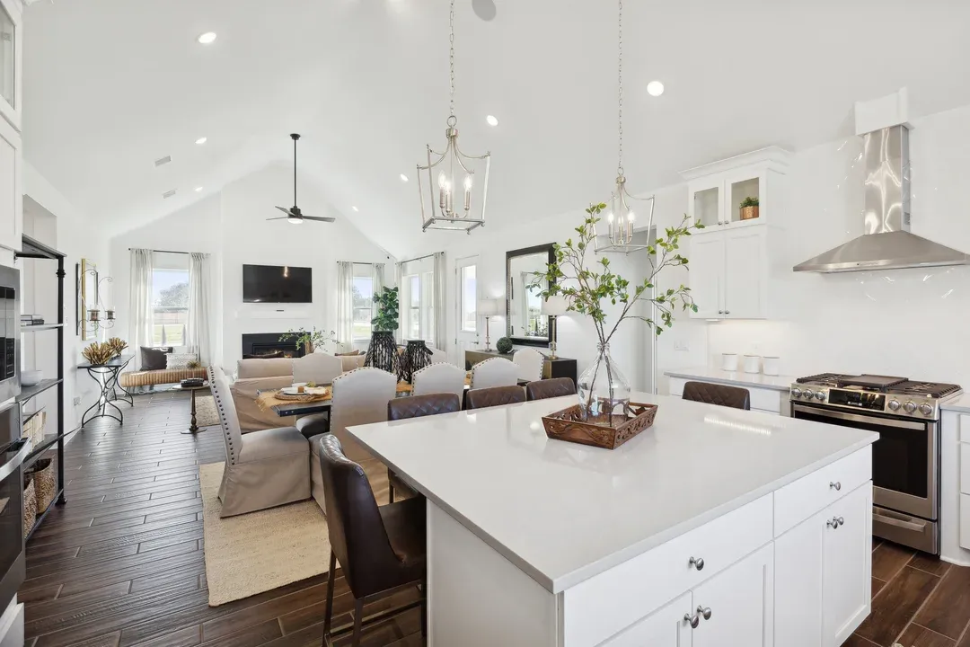 Kitchen with vaulted ceiling and pendant lighting