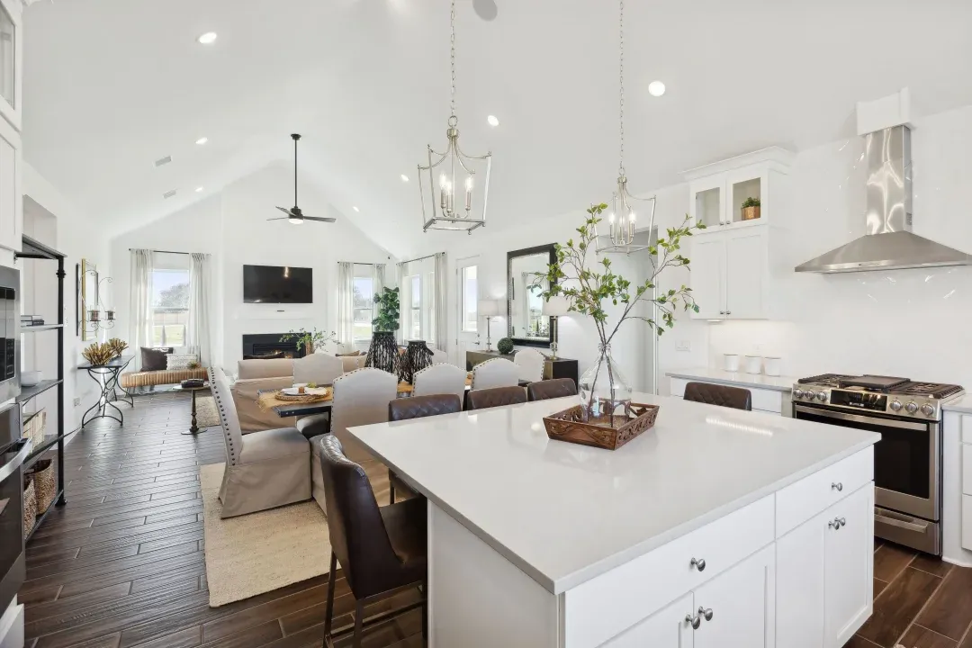 Kitchen with vaulted ceiling and pendant lighting