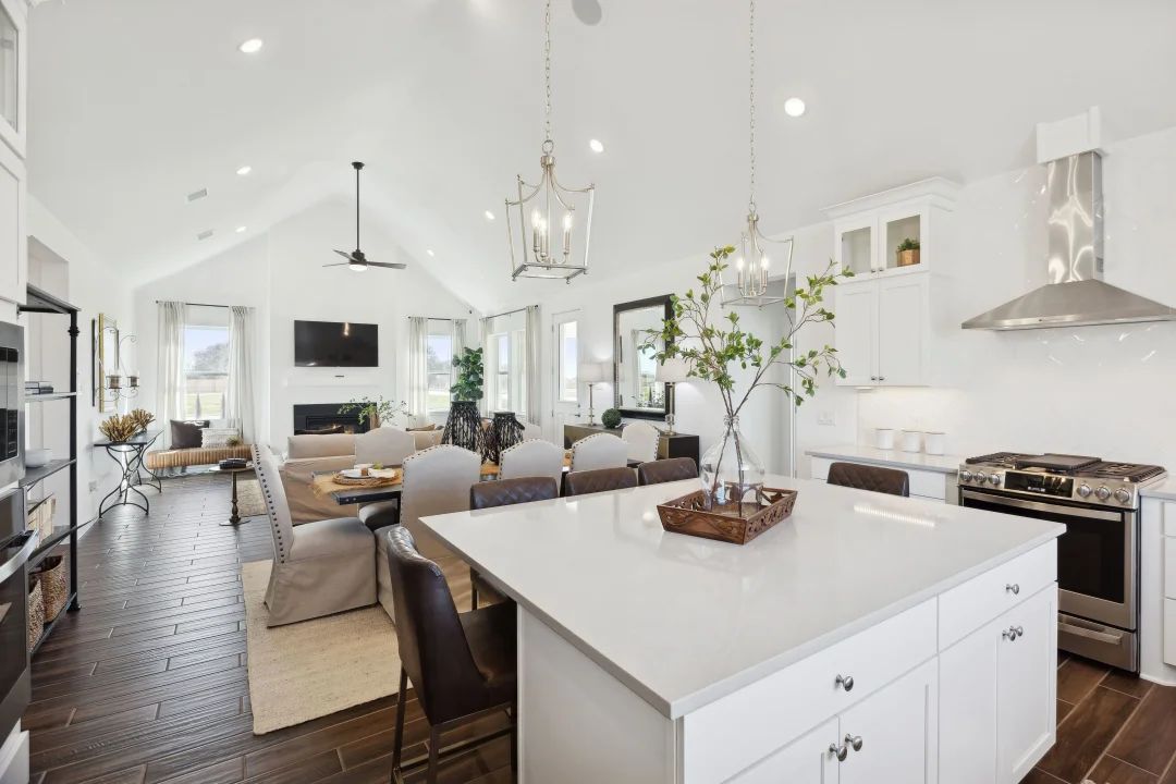 Kitchen with vaulted ceiling and pendant lighting