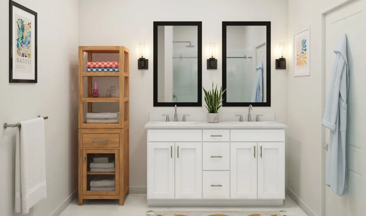 Primary bath with chrome fixtures and black-framed mirrors