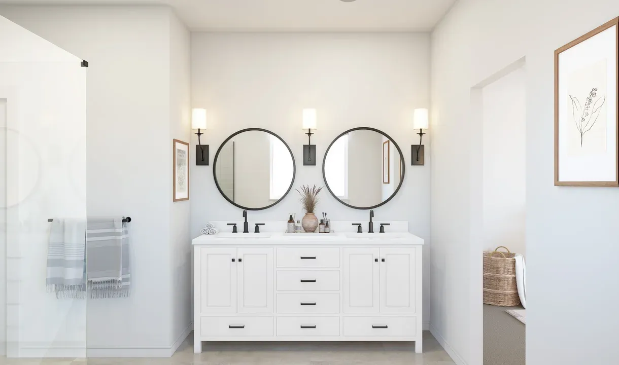 Primary bath with freestanding vanity and black-framed mirrors