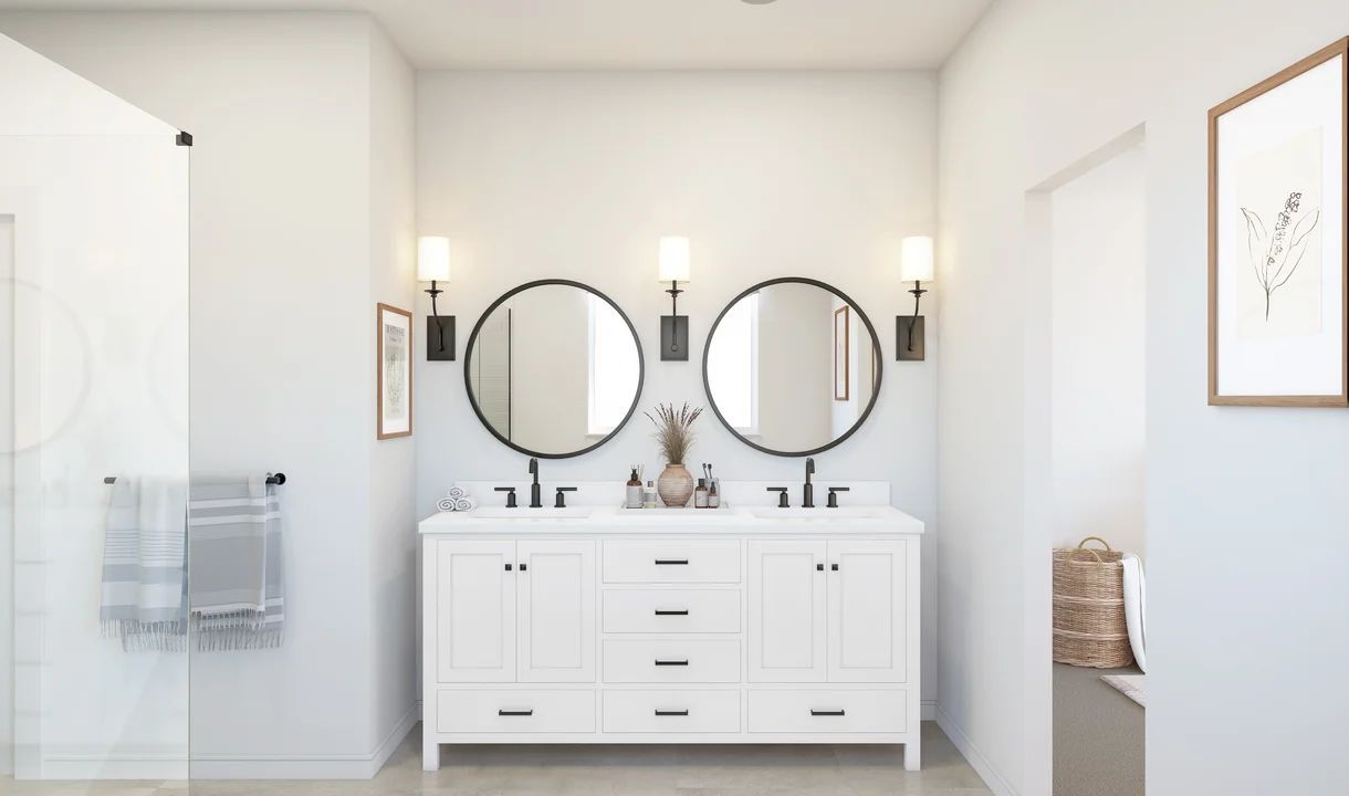 Primary bath with freestanding vanity and black-framed mirrors