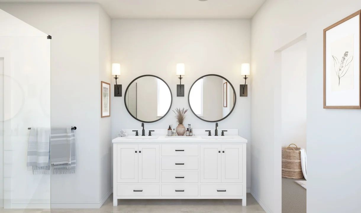 Primary bath with freestanding vanity and black-framed mirrors