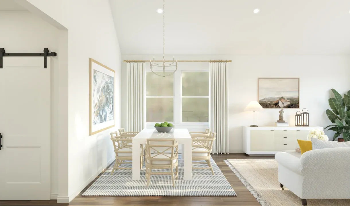 Dining area with vaulted ceiling and chandelier