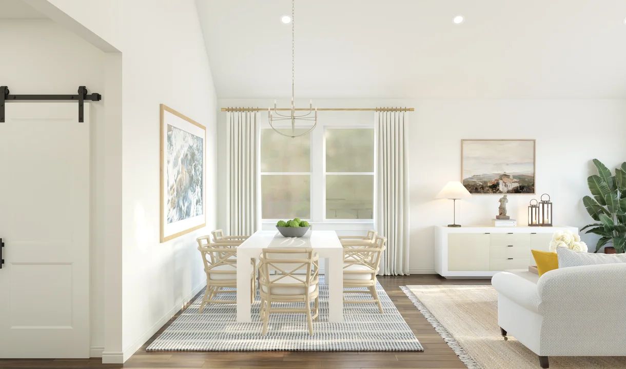 Dining area with vaulted ceiling and chandelier