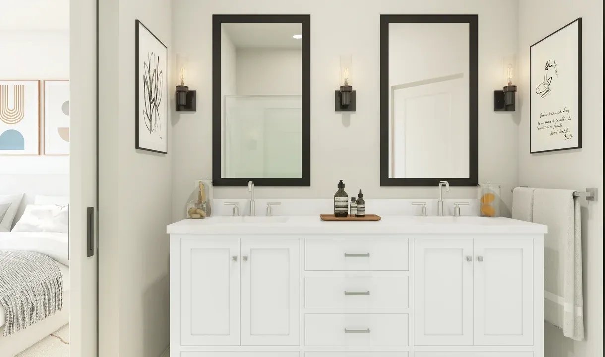 Primary bath with black-framed mirrors and dual sinks
