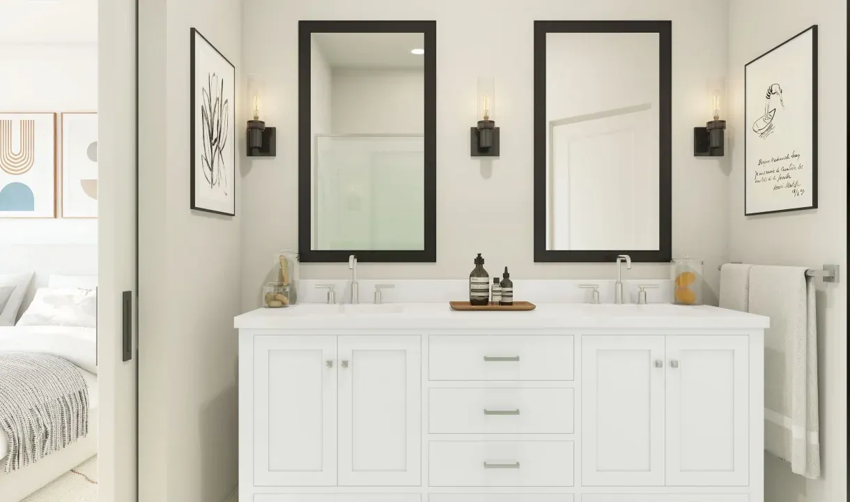 Primary bath with black-framed mirrors and dual sinks