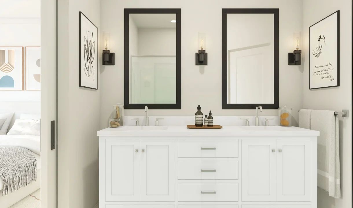 Primary bath with black-framed mirrors and dual sinks