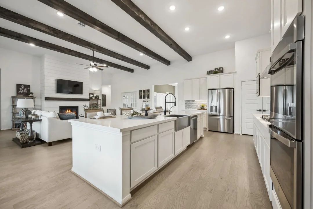 Kitchen with stainless steel apron-front sink and appliances