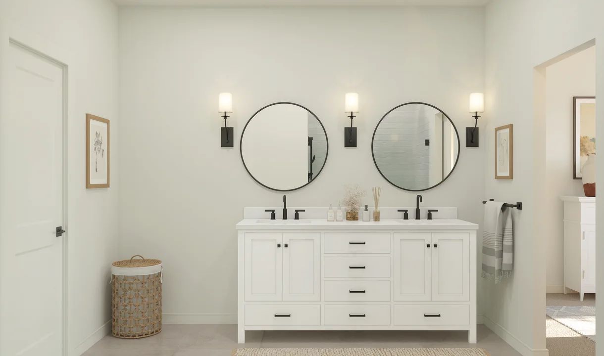 Primary bath features freestanding vanity with dual sinks