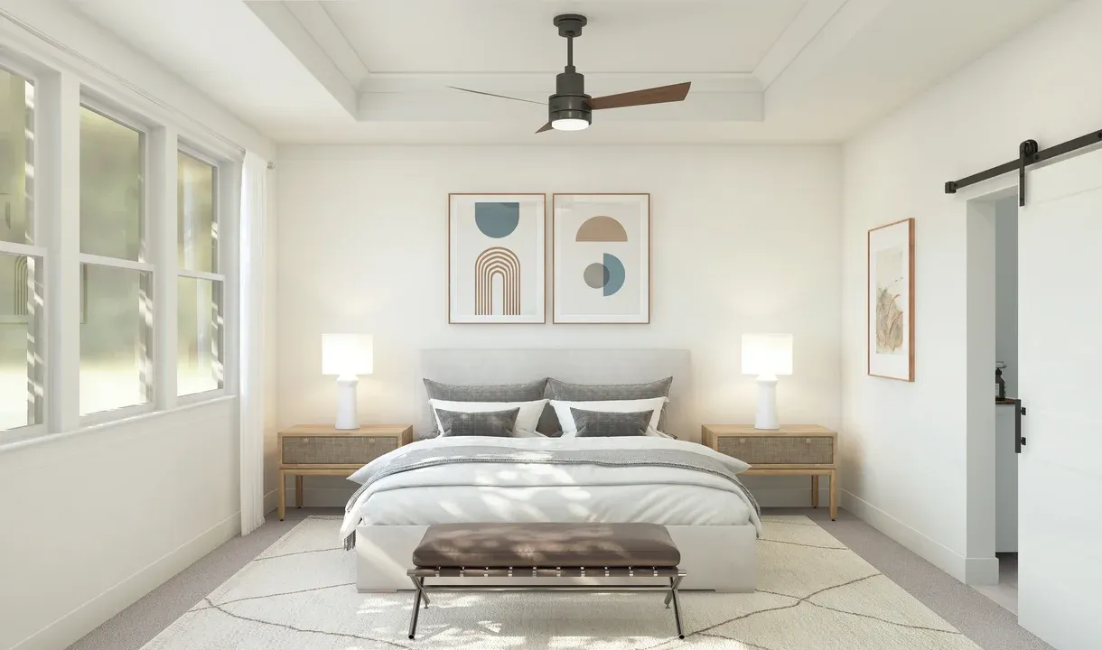 Primary suite with crown moulding and sliding barn door