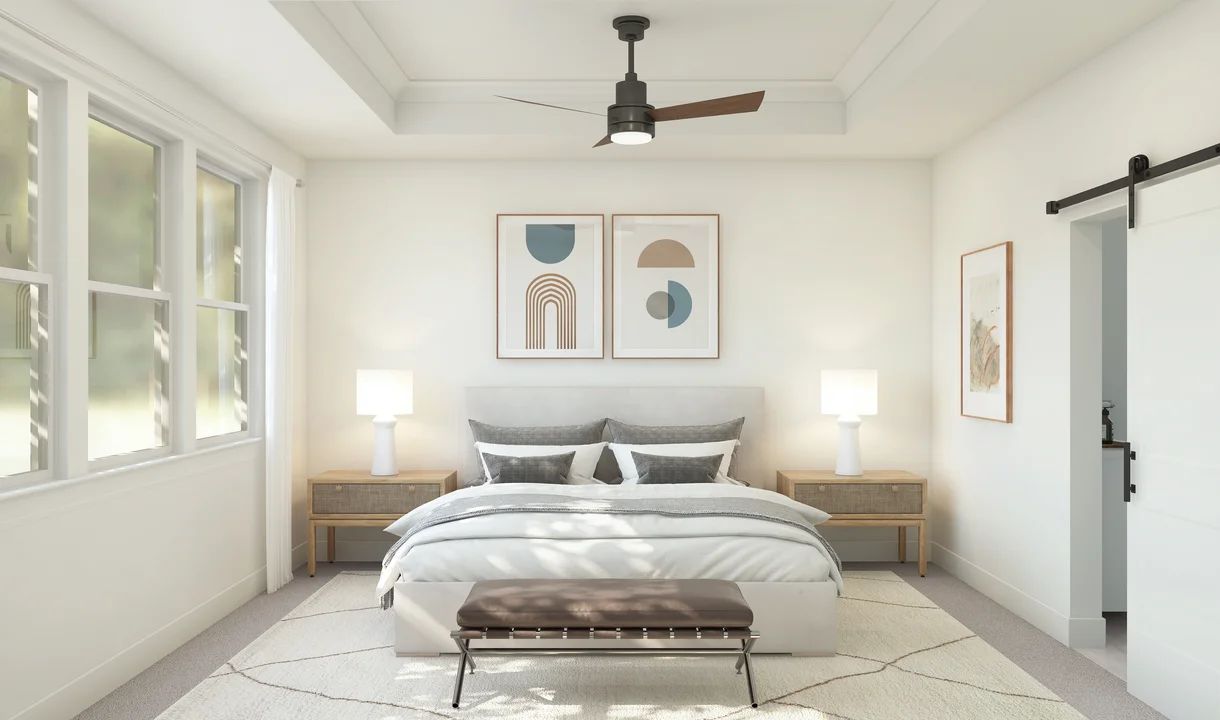 Primary suite with crown moulding and sliding barn door