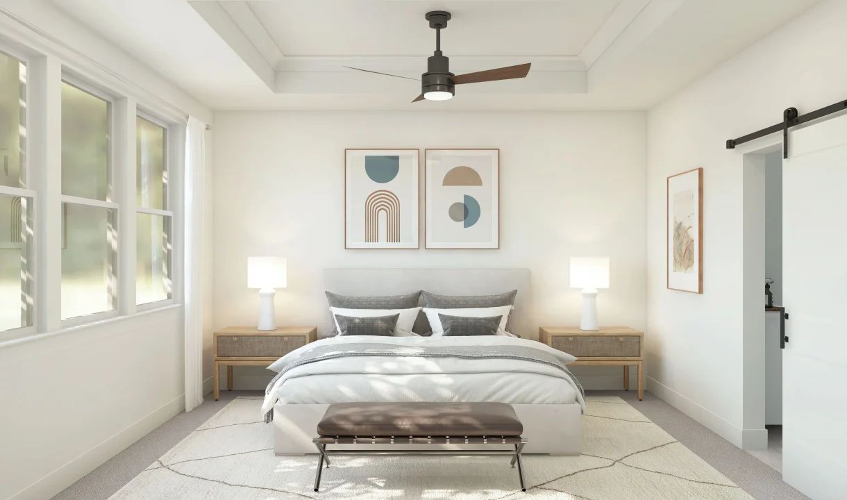 Primary suite with crown moulding and sliding barn door