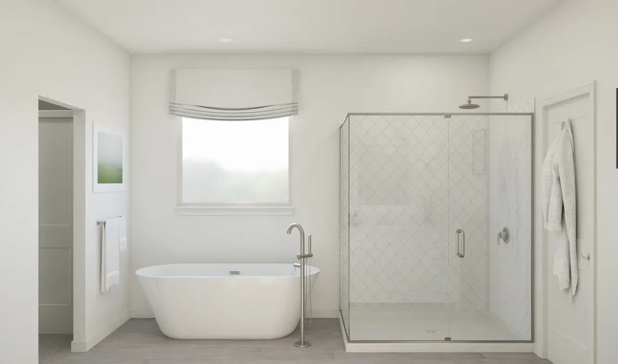 Primary bath with freestanding tub and glass shower enclosure