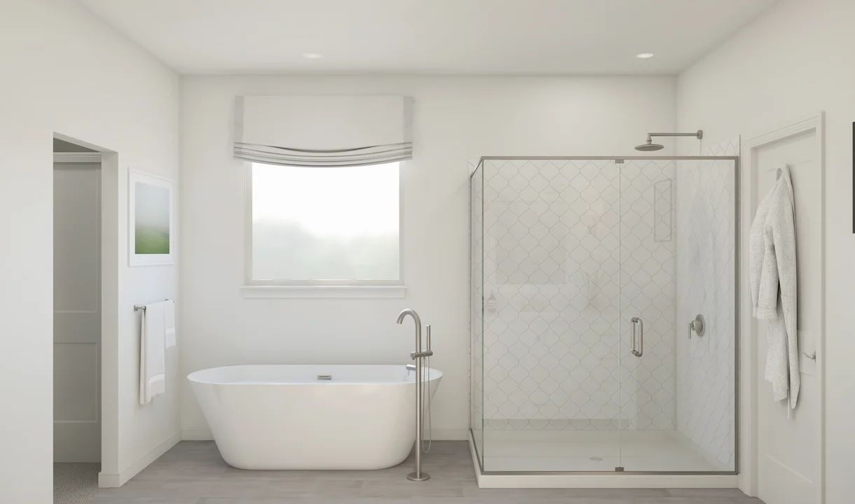 Primary bath with freestanding tub and glass shower enclosure