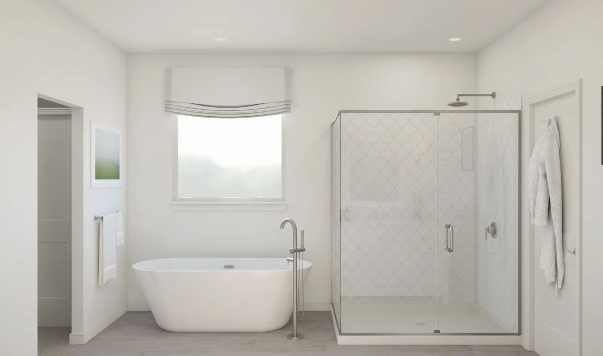 Primary bath with freestanding tub and glass shower enclosure