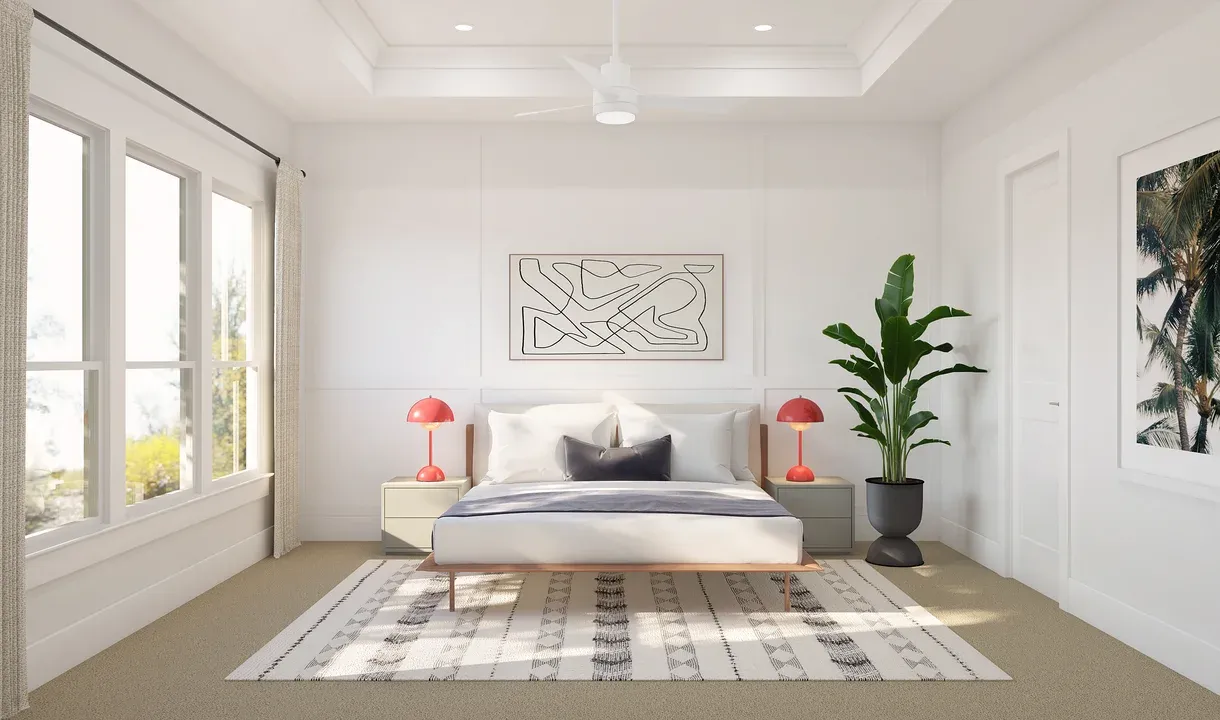 Primary suite with decorative feature wall and tray ceiling