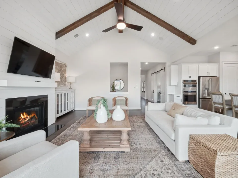 Great room with vaulted ceiling and stained ceiling beams