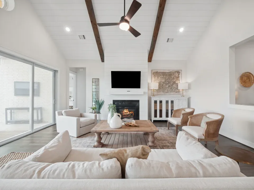 Great room with fireplace and stained ceiling beams