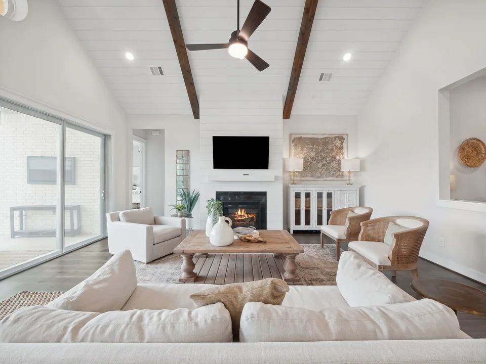 Great room with fireplace and stained ceiling beams