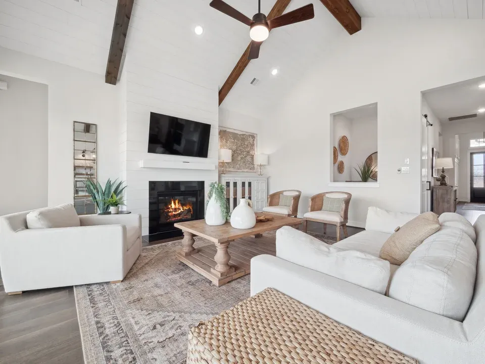 Great room with vaulted ceiling and fireplace