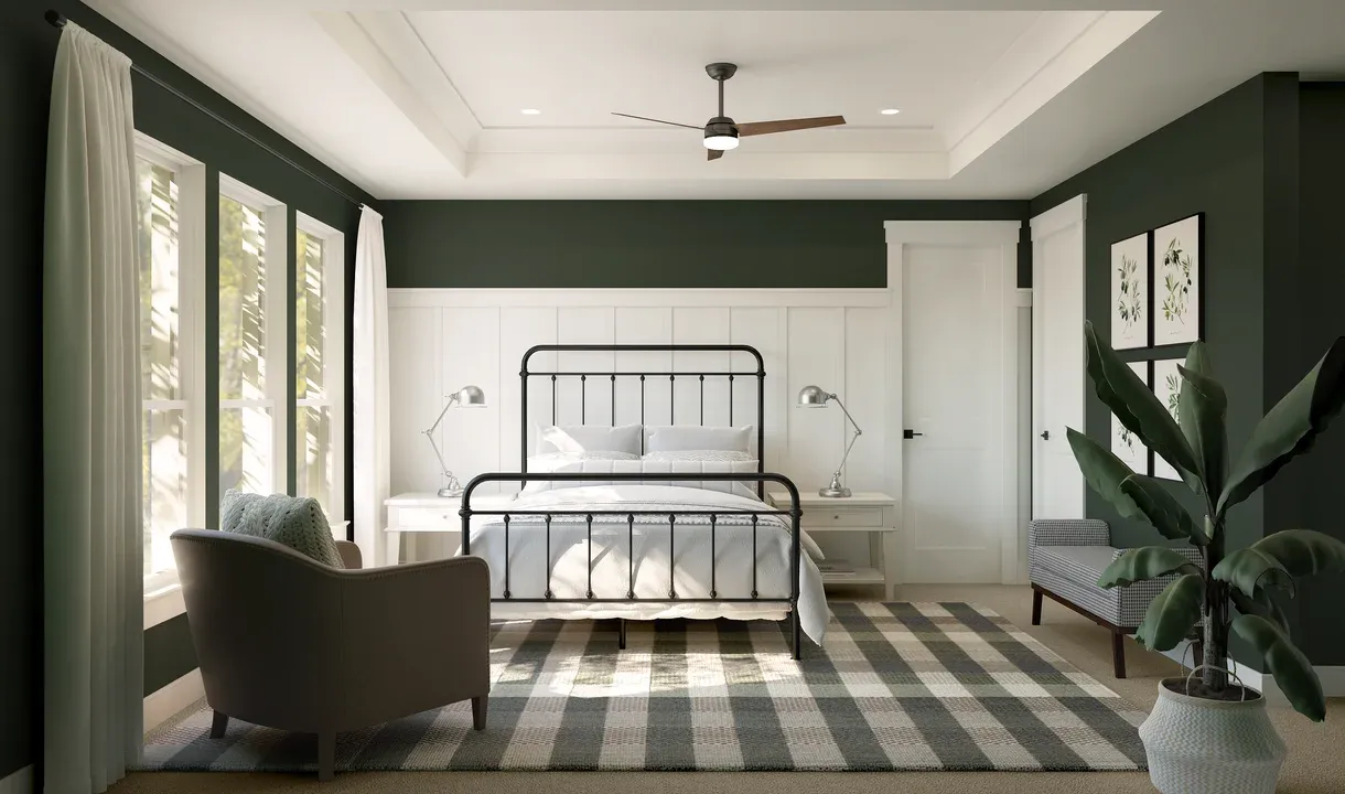 Primary suite with decorative feature wall and tray ceiling with crown moulding