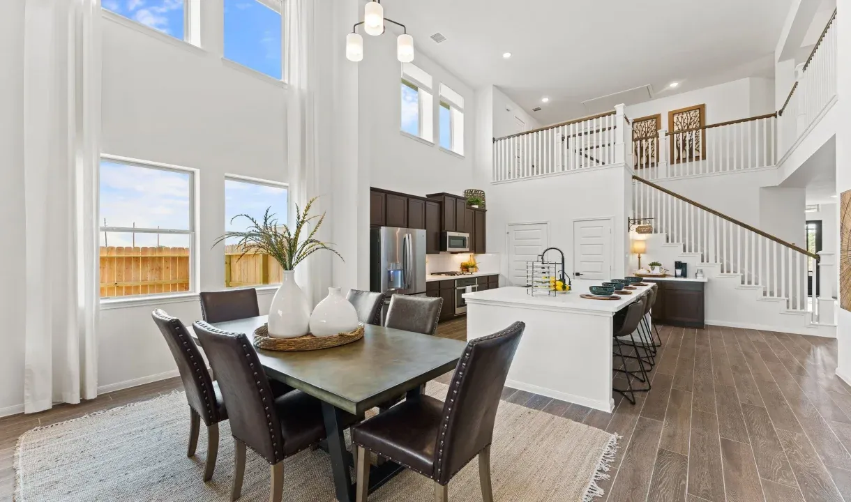 Dining area with two story ceiling