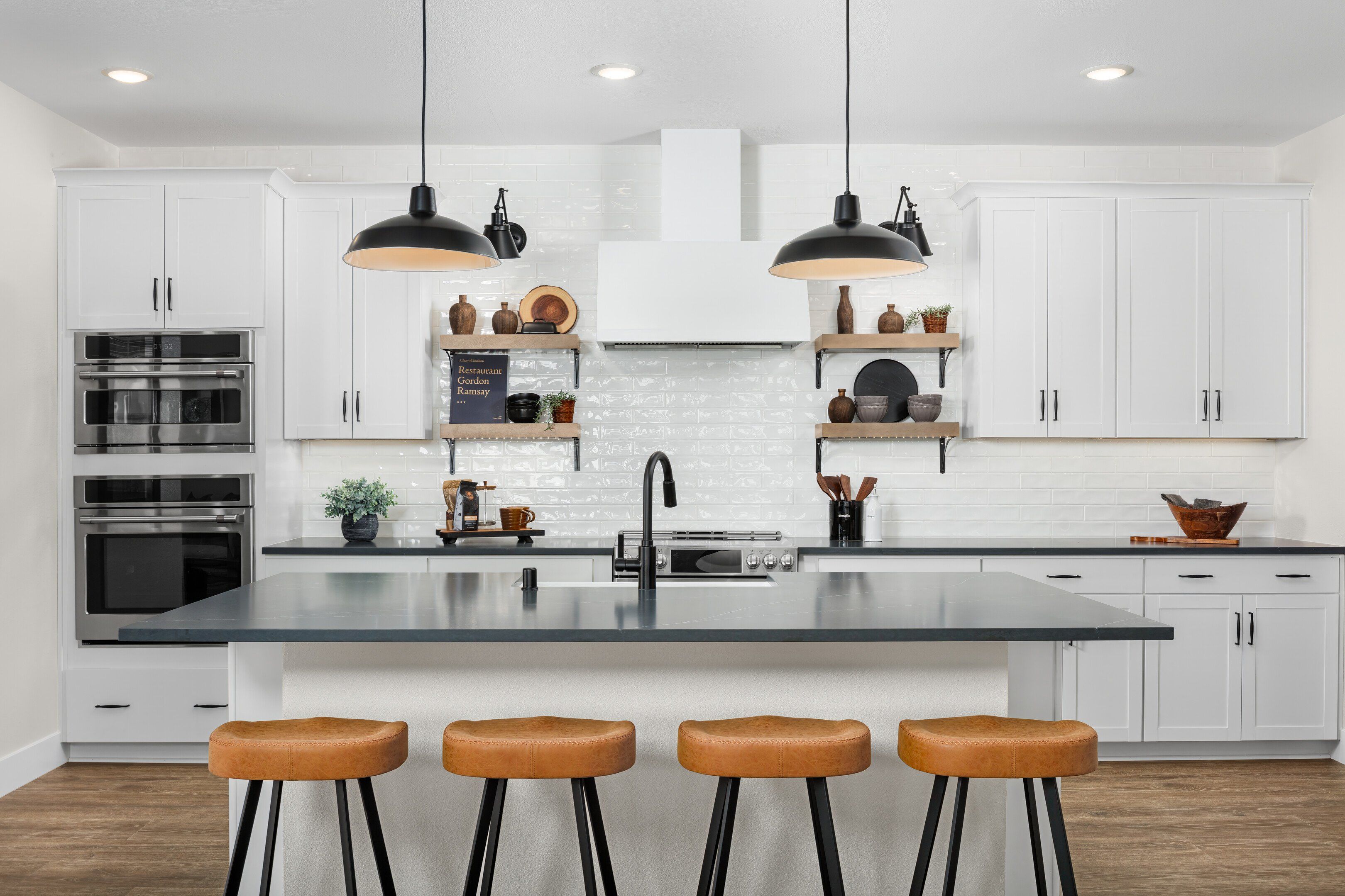 Kitchen with pendant lighting and subway tile backsplash