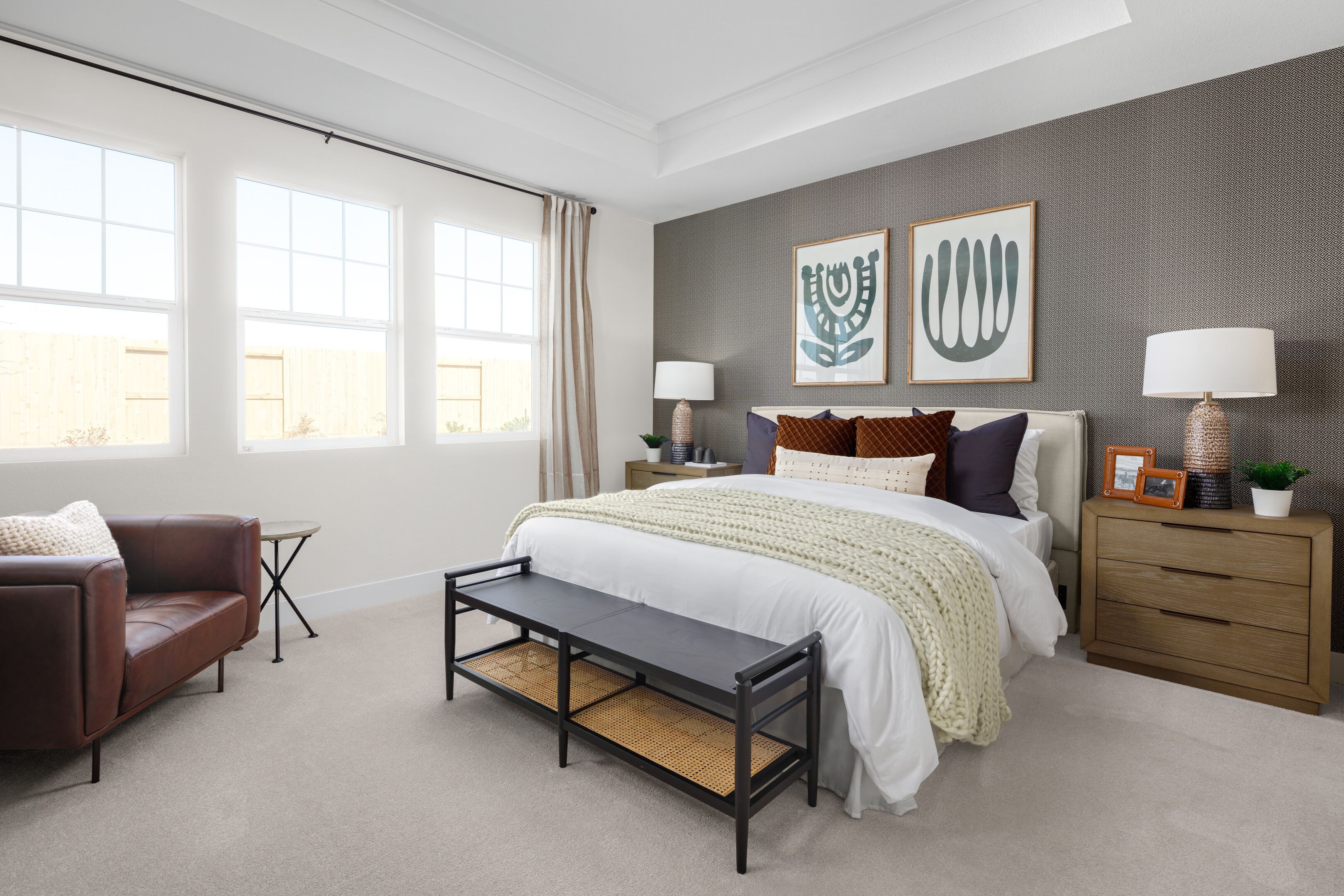 Primary suite with tray ceiling and crown moulding