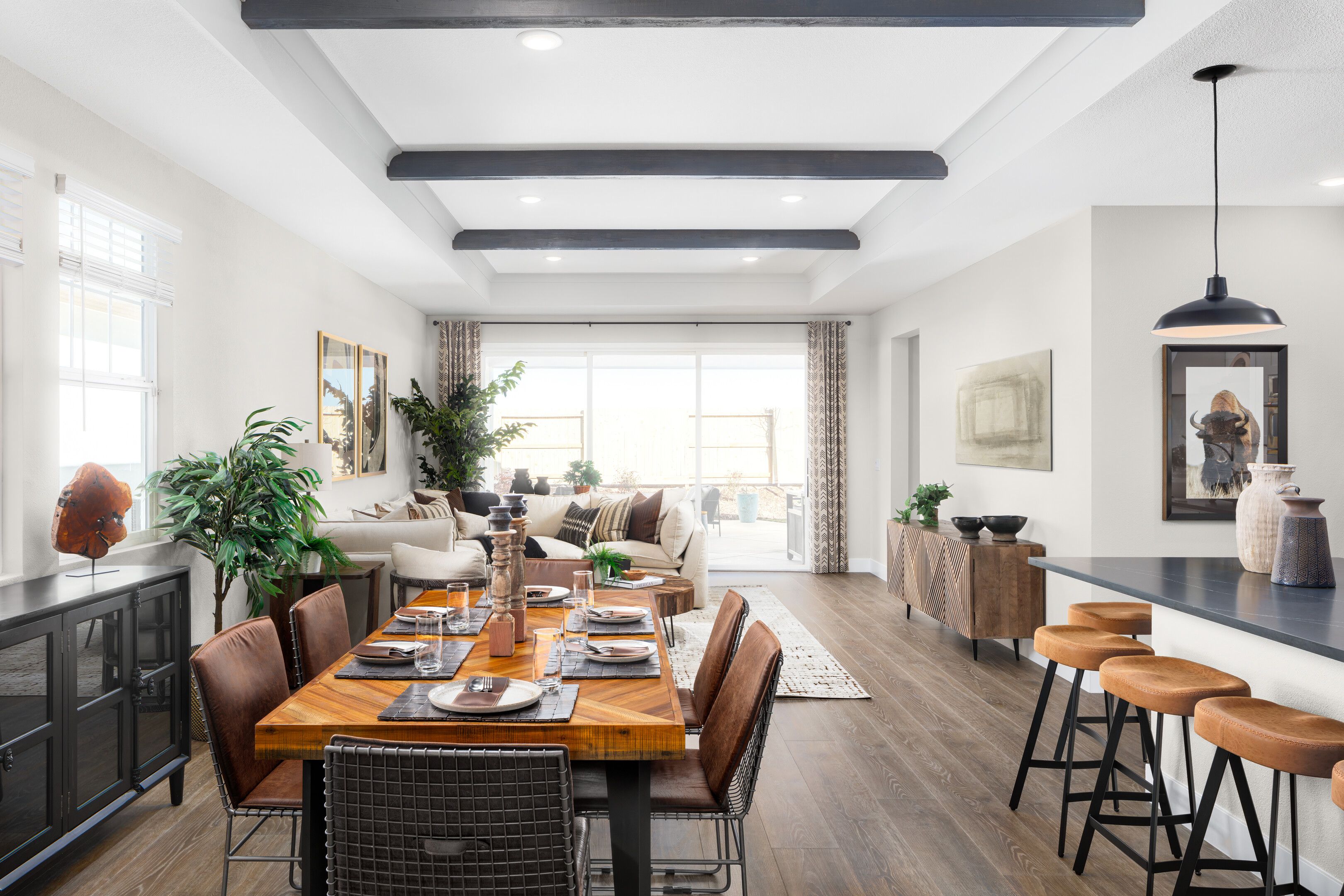 Dining area with ceiling treatment and stained ceiling beams