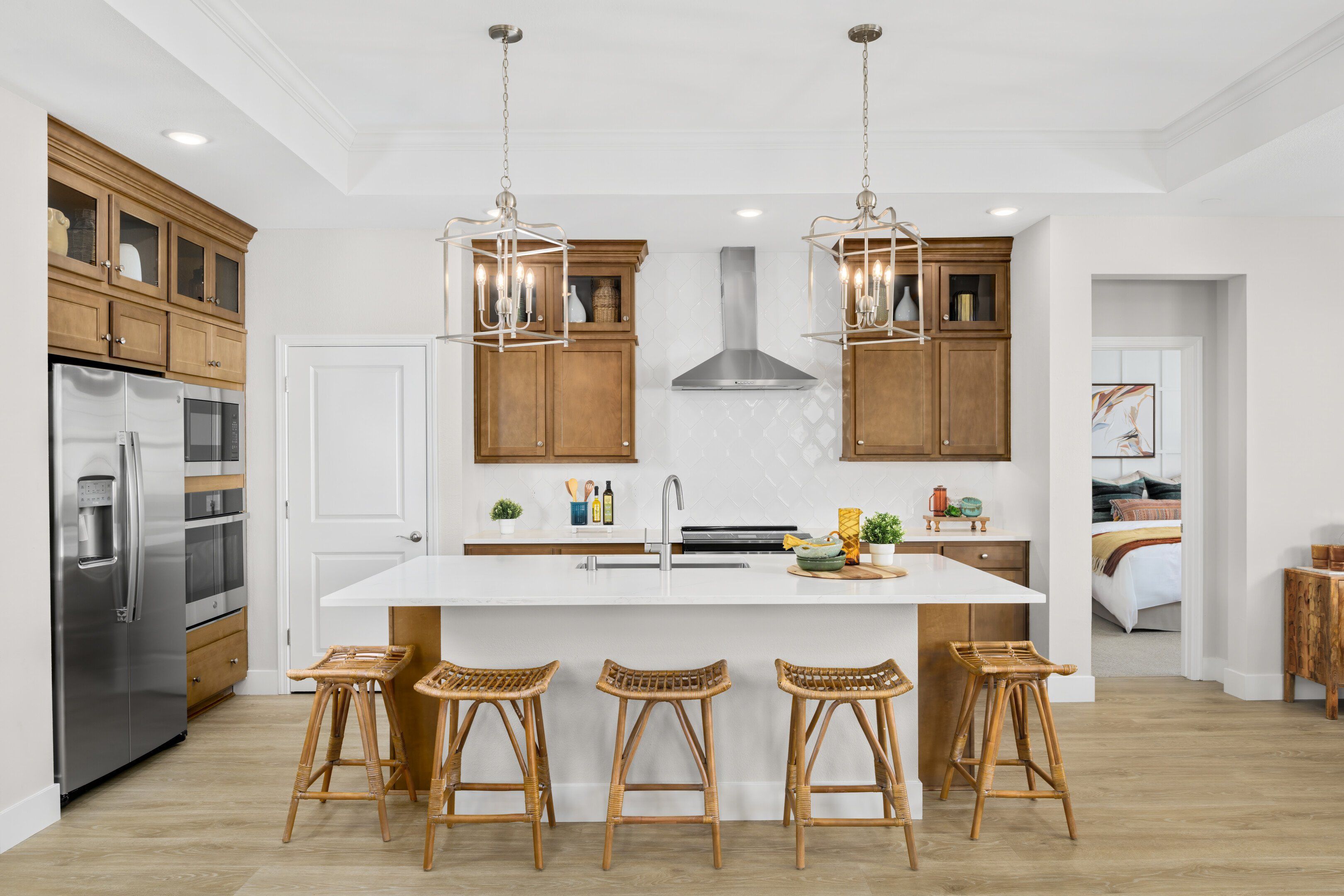 Kitchen with pendant lighting and glass upper cabinets