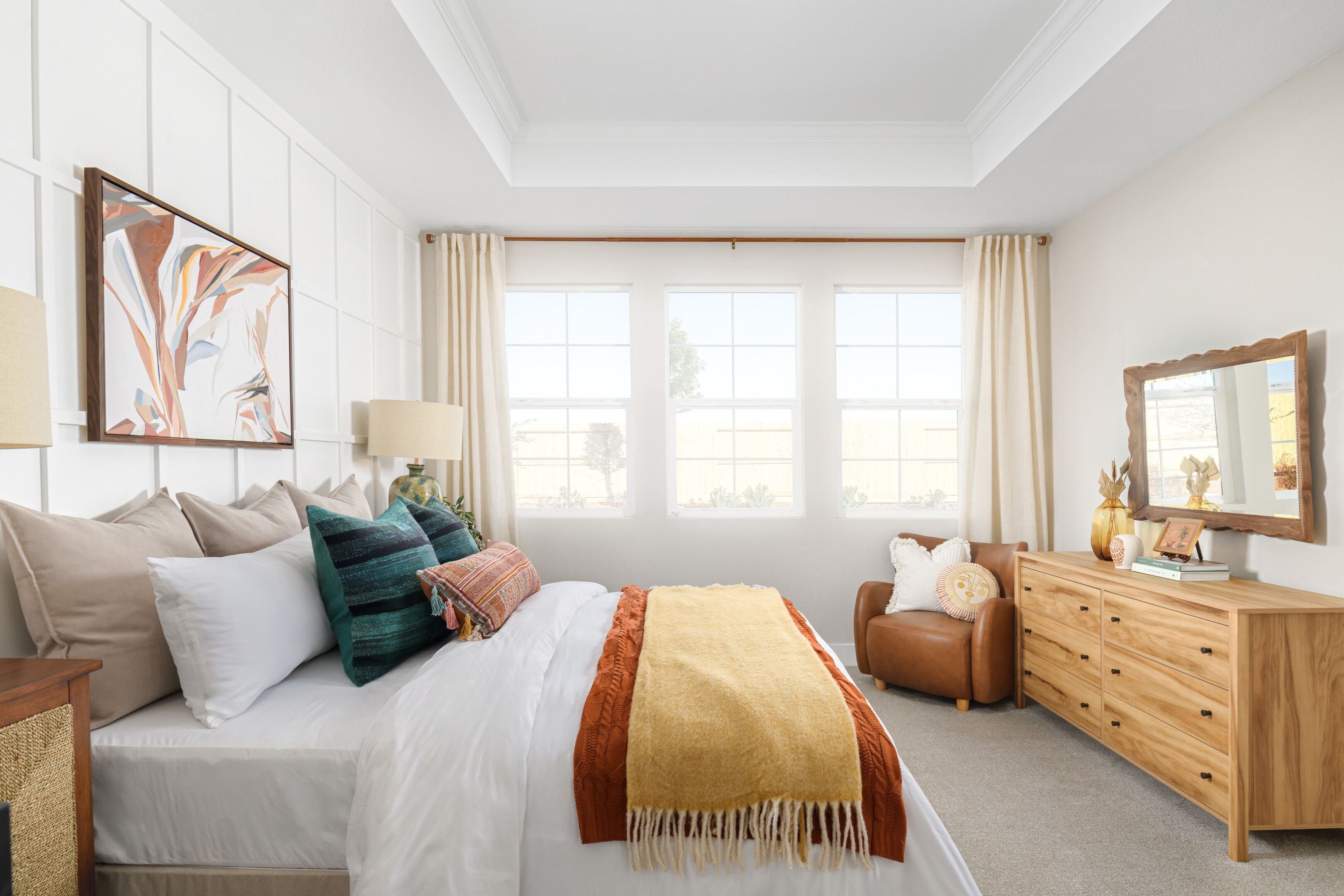 Decorative feature wall in primary suite adding a touch of elegance