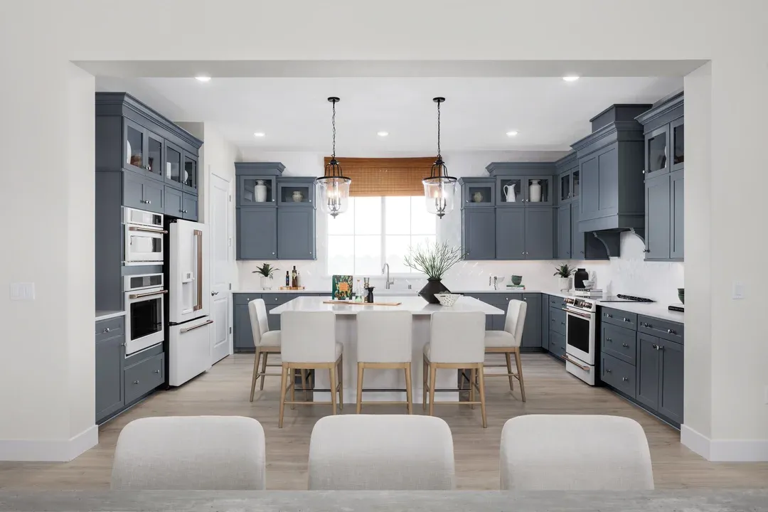 Kitchen with pendant lighting and glass upper cabinets